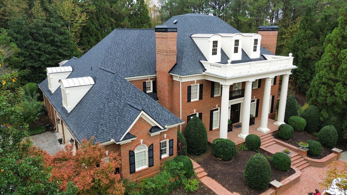 Completed CertainTeed Landmark Pro Moire Black roof — front-left drone view
