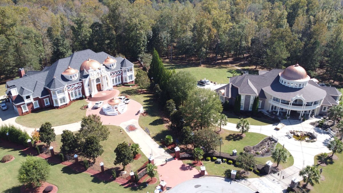 Completed GAF Timberline HDZ Charcoal roof — aerial view with copper accents