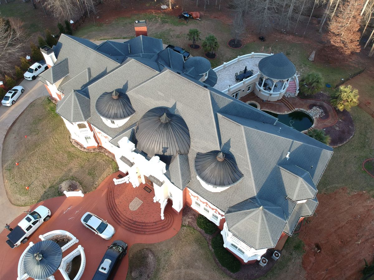 Drone overview of home before GAF Timberline HDZ Charcoal roof replacement
