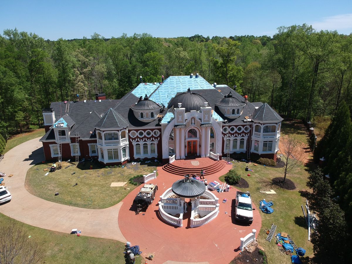 Charcoal shingle installation progress — GAF Timberline HDZ being laid