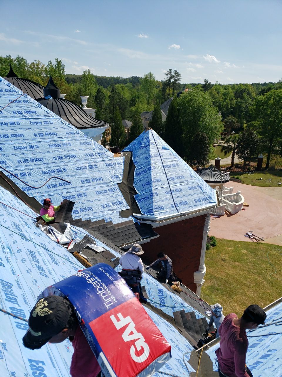 Aerial view of GAF Timberline HDZ Charcoal roof during mid-installation