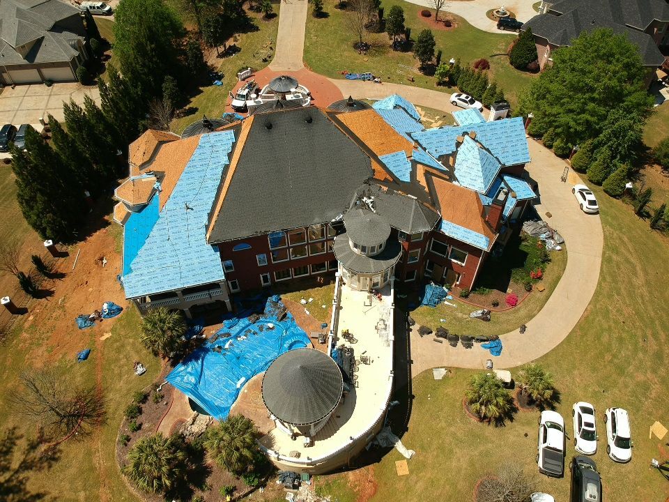 Roof replacement in progress — HDZ Charcoal shingles and copper work
