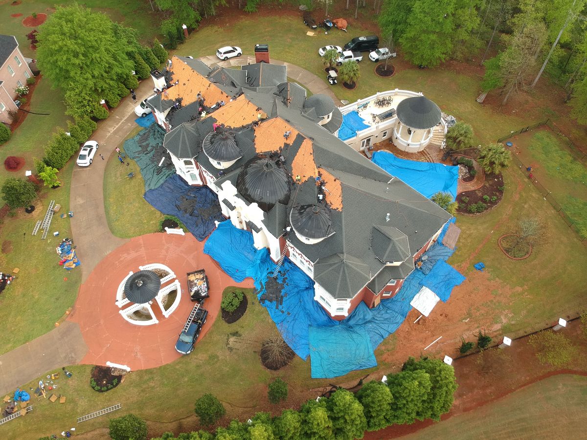 Drone documentation of GAF Timberline HDZ installation with copper accents