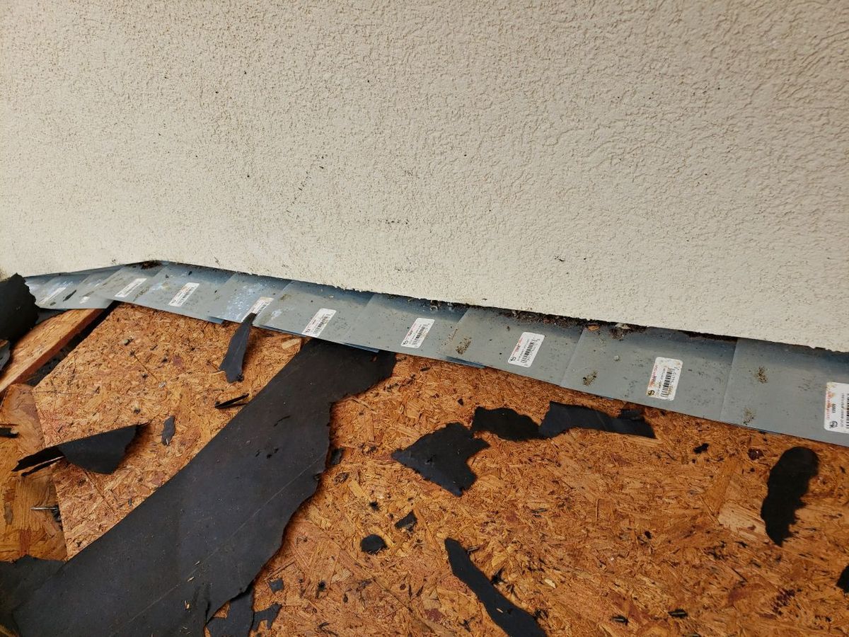 Custom copper roofing work alongside GAF Timberline HDZ Charcoal installation