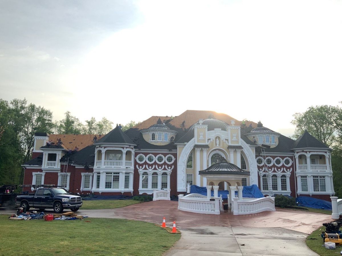 GAF Timberline HDZ Charcoal roof nearing completion — copper details visible